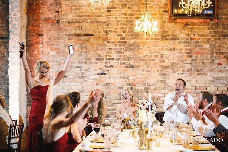 Wedding party cheering during speech