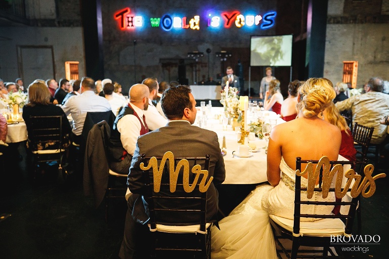 Rachel and Joe sitting at Mr and Mrs chairs