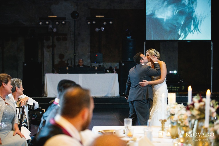 Rachel and Joe kissing during toast