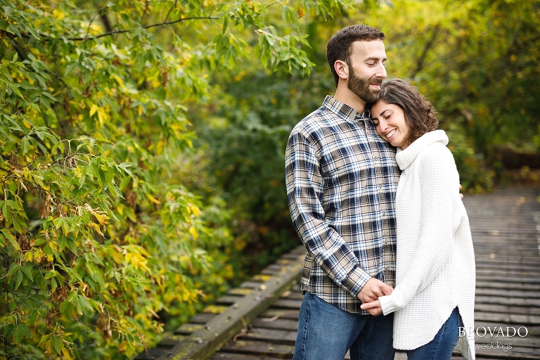 Stephanie leaning against her fiance Loren's chest