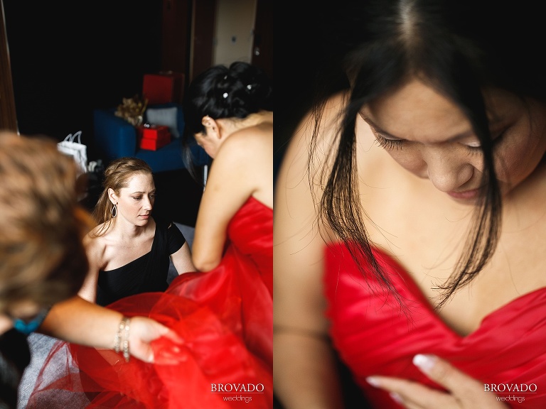 Christine putting on her red wedding dress