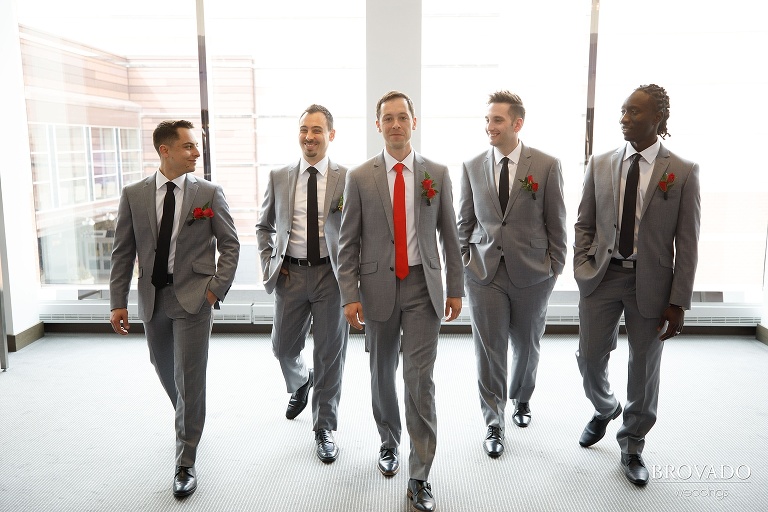 Groom and groomsmen walking towards the camera