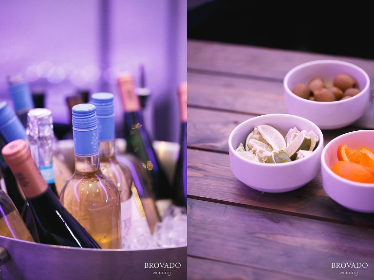 closeup of wine bottles and limes