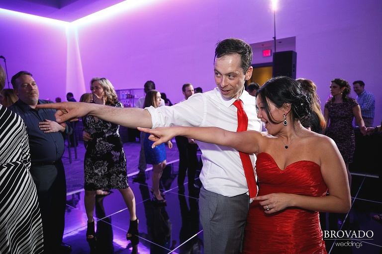 Christine and Nick goofily dancing together