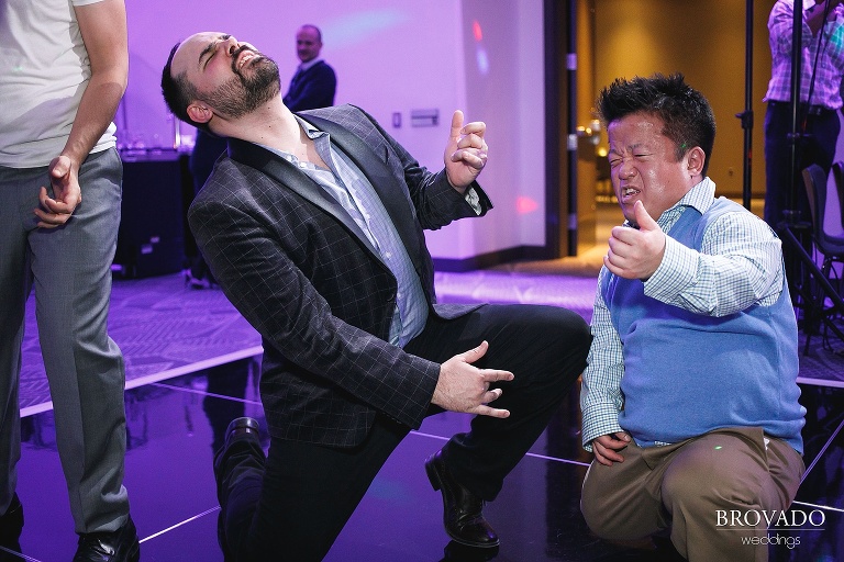Guests playing air guitar during reception