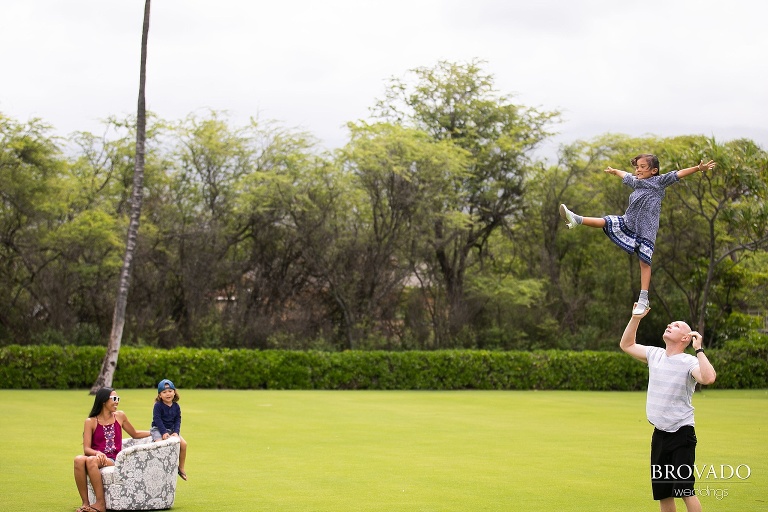 Brandon balancing the birthday girl on his hand