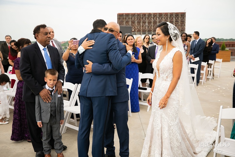 Rishi hugging Lorena's father