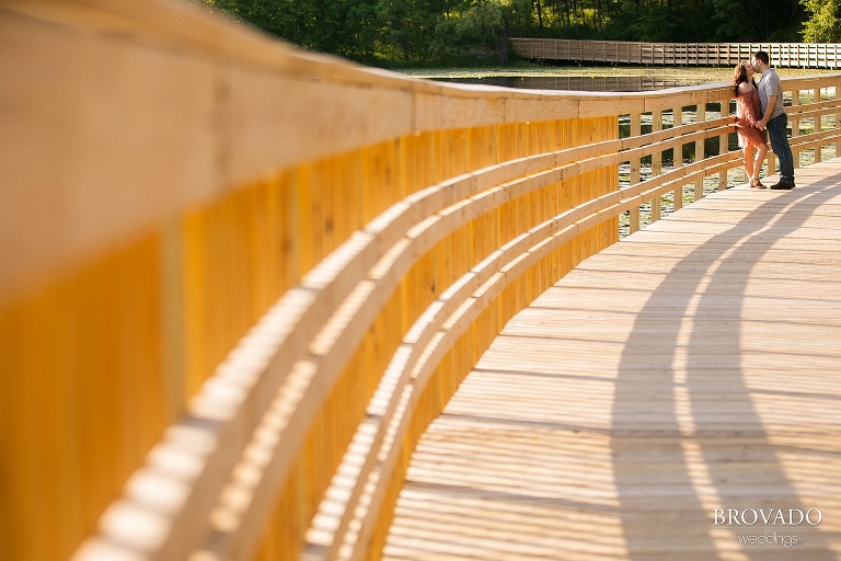 Jacquelyn and Brian kissing on a bridge
