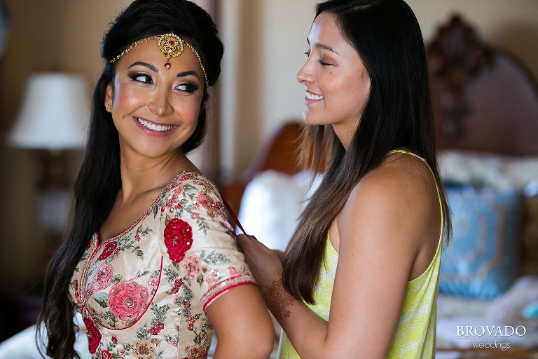 Lorena's sister helping her get dressed