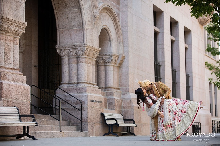 Rishi dipping Lorena in front of the Landmark Center