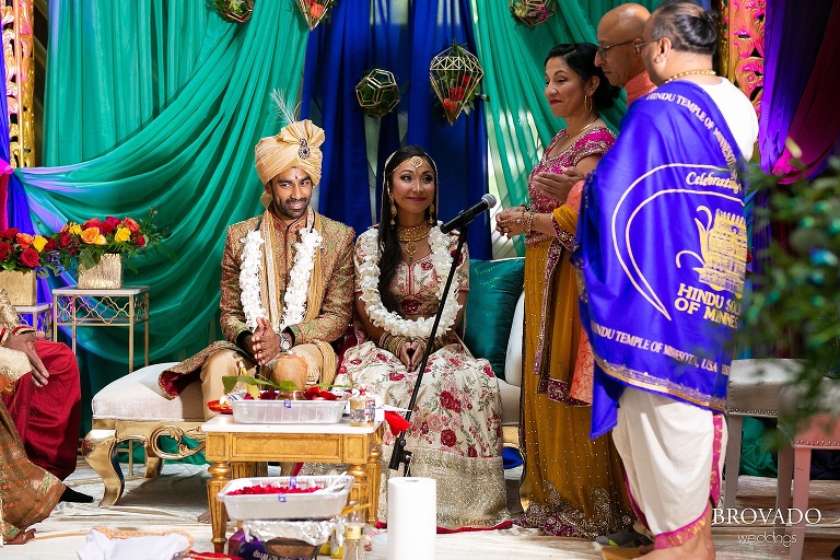 Bride and groom smiling during indian wedding ceremony