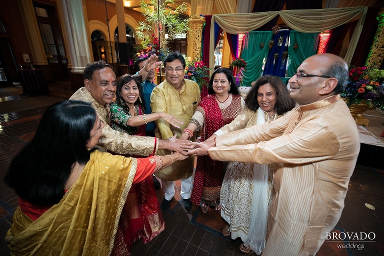 Rishi's family cheering at wedding reception