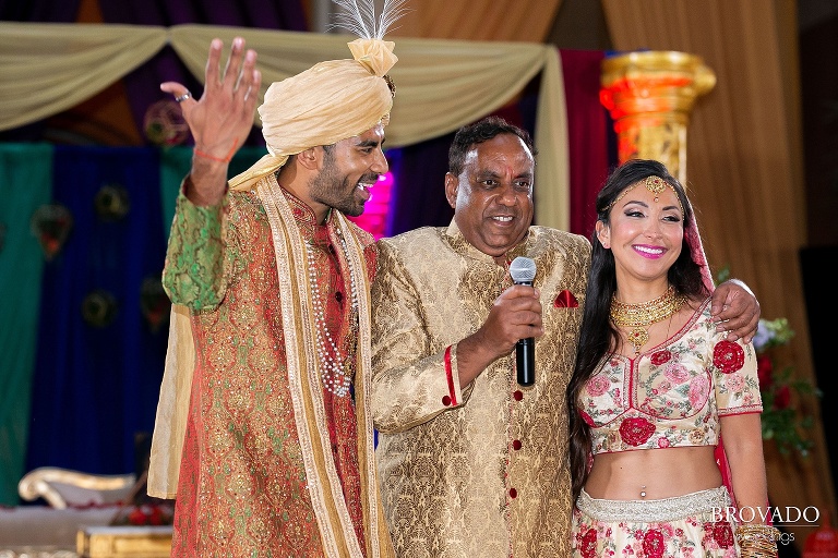 Rishi's father introducing the bride and groom
