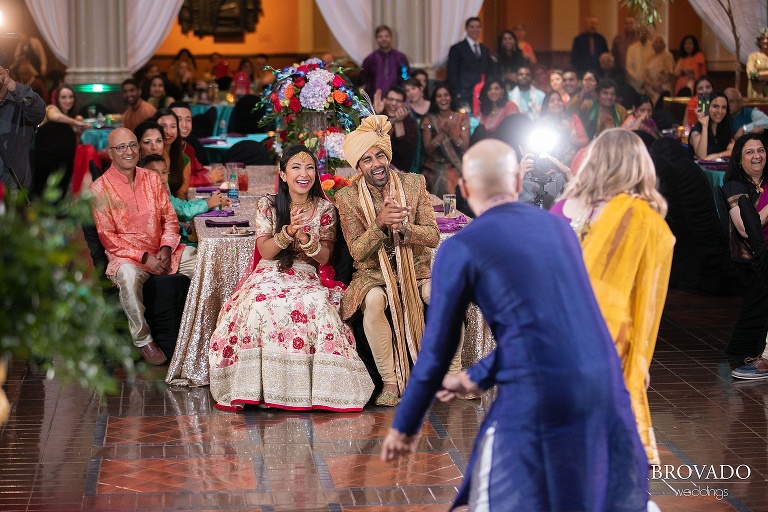 Rishi and Lorena clapping during wedding reception dances