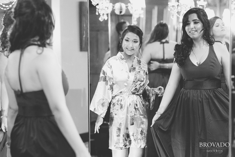 Bridesmaid checking out her dress in the mirror