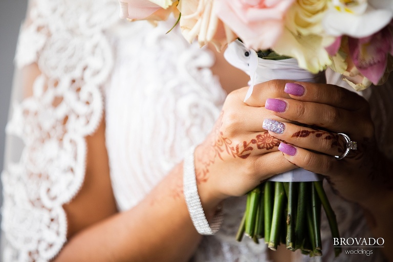 closeup of Lorena's manicure wedding ring and bouquet