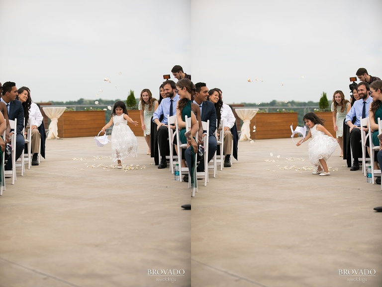 Flower girl dancing down the aisle