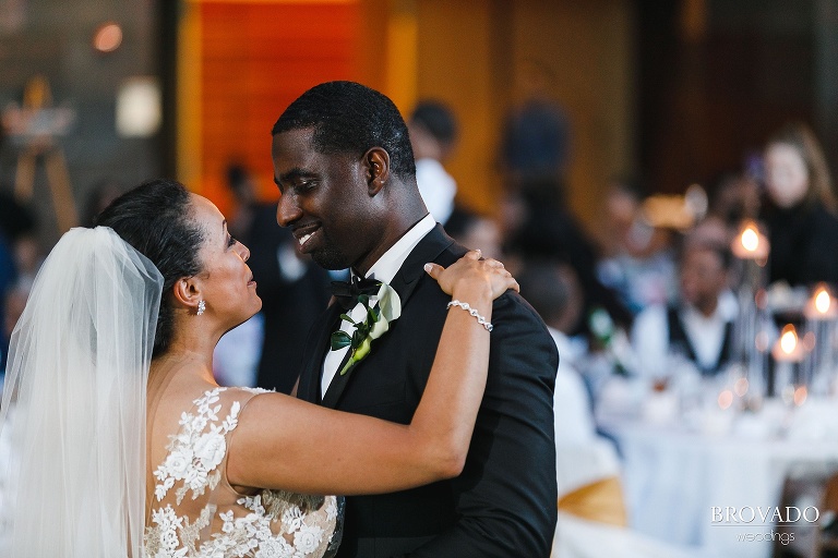 bride and groom smiling during first dance