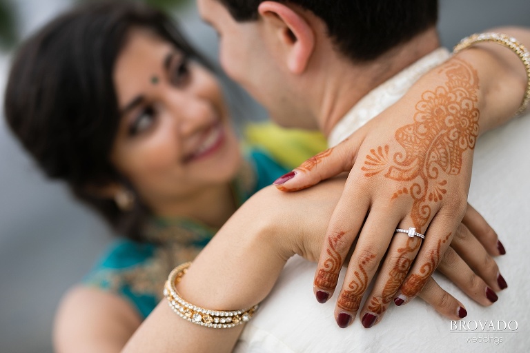 Closeup of engagement ring and henna