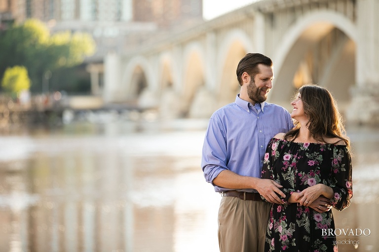 Karen and Matthew posing in front of the stone arch bridge