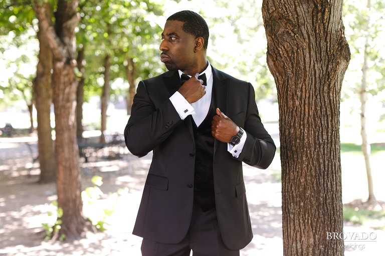 Groom Glenn adjusting his bowtie