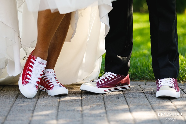 closeup of bride and groom's converse shoes