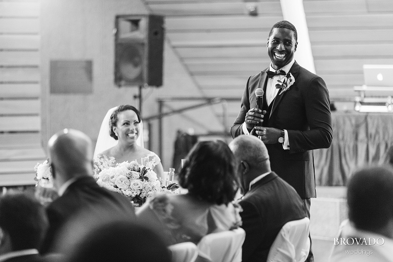 Groom smiling during his speech