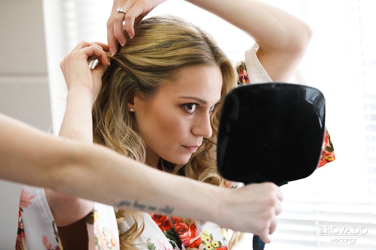 Bride Erin pulling her hair back