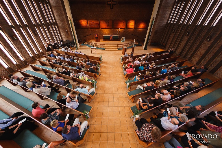 Guests waiting in the church before wedding ceremony