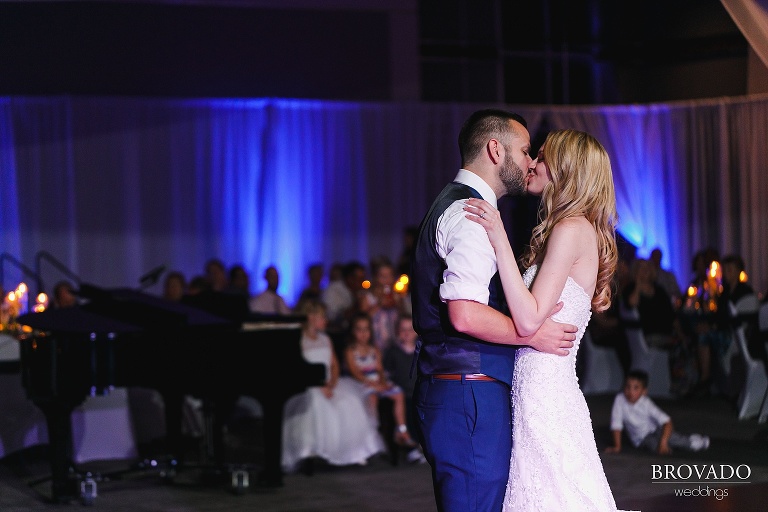 Bride and groom kiss during first dance