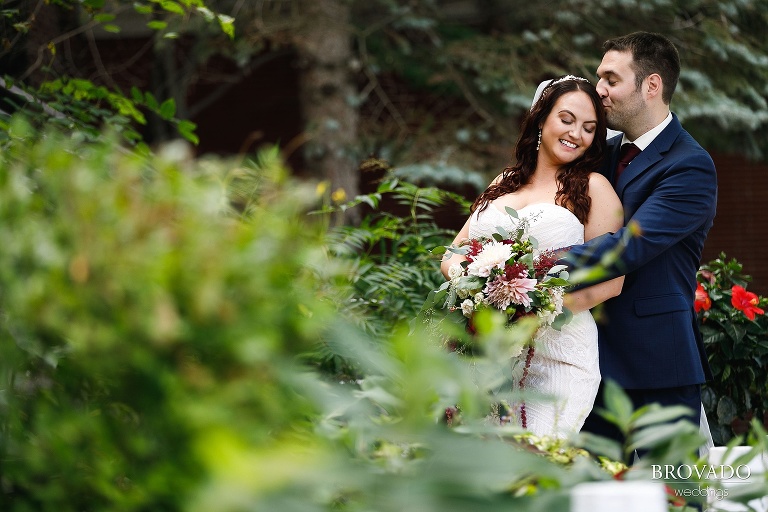 Brian kissing the bride's head