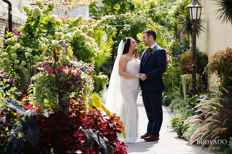 Jacquelyn and Brian in landscaped alley behind venue