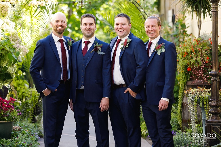 Groom laughing with the groomsmen