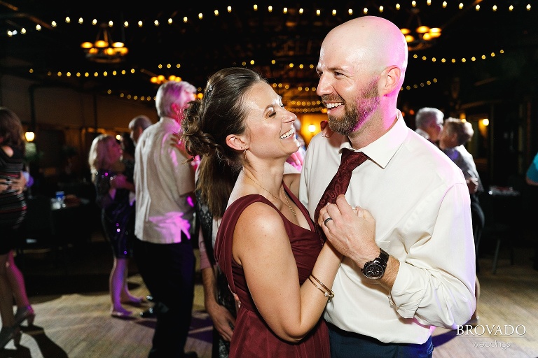 Bridesmaid and groomsman dancing together
