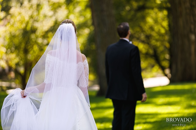 Bride sneaking up on her husband for a first look