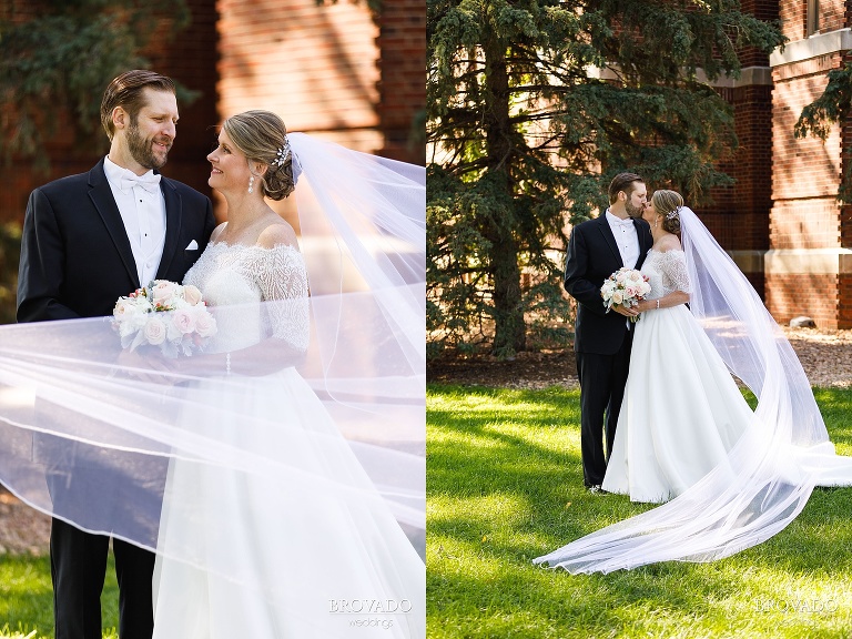 Bride and groom kissing in front of wedding venue