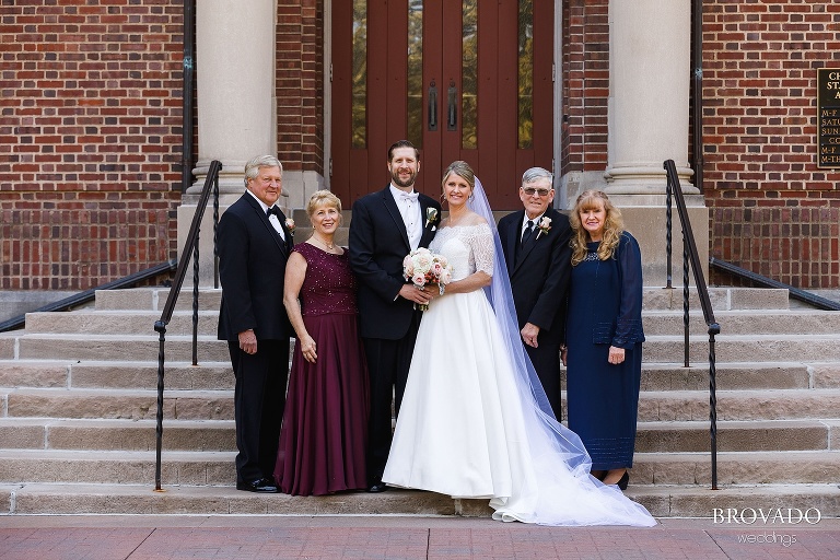 Bride and groom pose with their parents