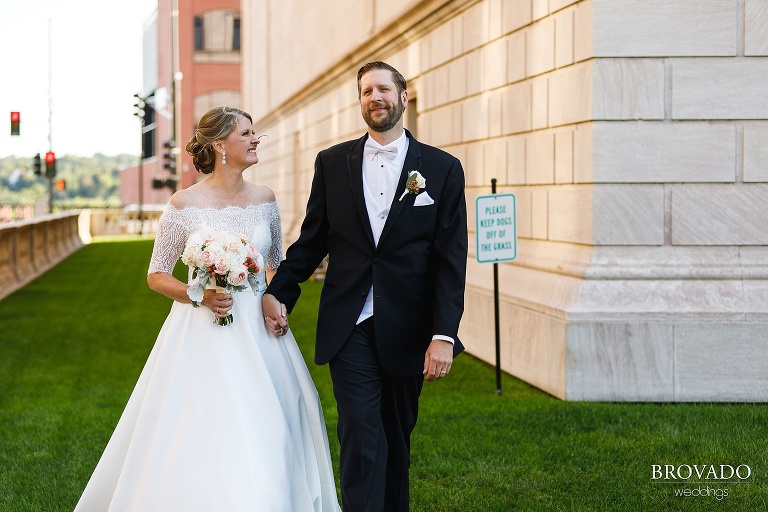 Karen and Matthew holding hands on the St. Paul Library lawn