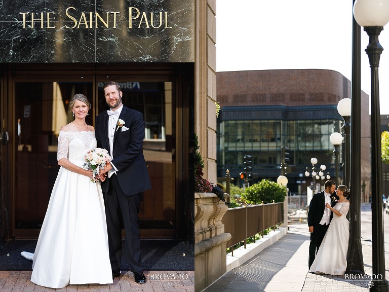Bride and groom pose in front of hotel