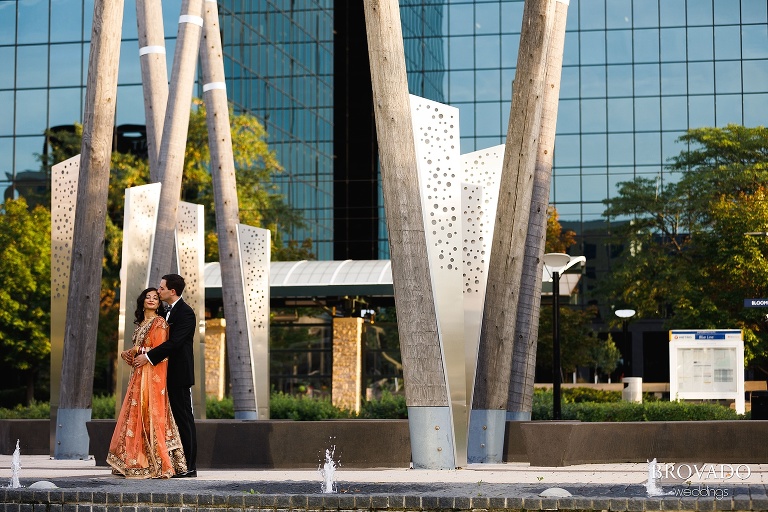 Sruti and Ethan posing in front of Hyatt Bloomington