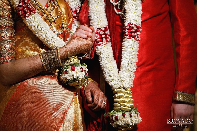 Sruti and Ethan holding hands during ceremony