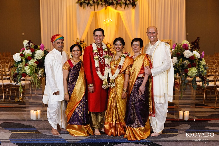 Bride and groom posing with their parents