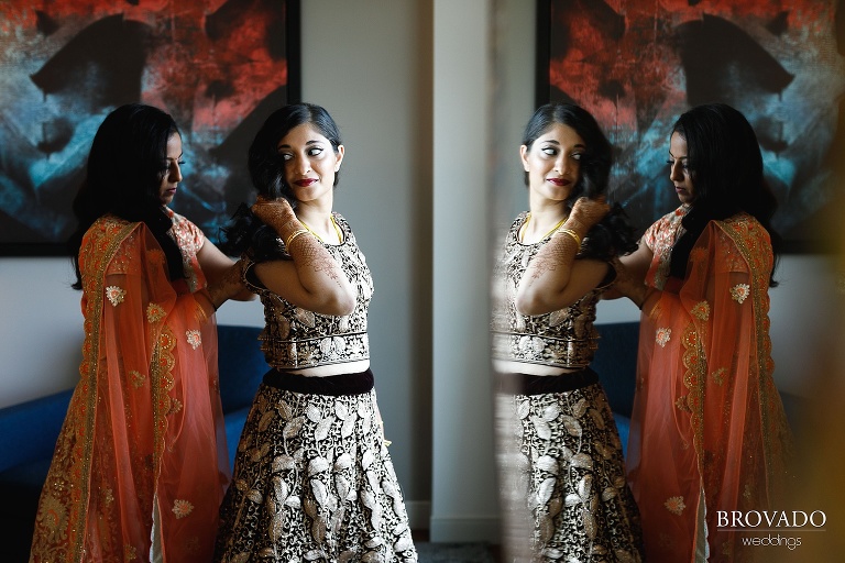 Sruti's sister helping her get dressed