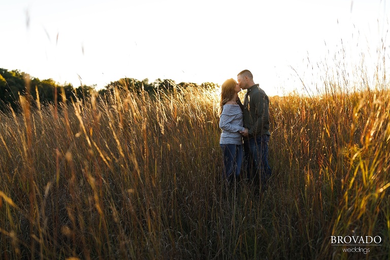 golden hour engagement photo in field