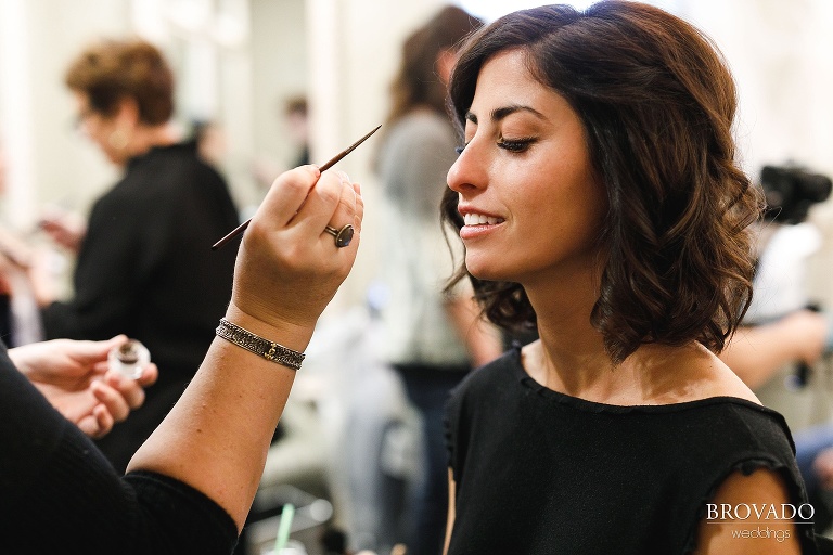 bride Stephanie getting her makeup done