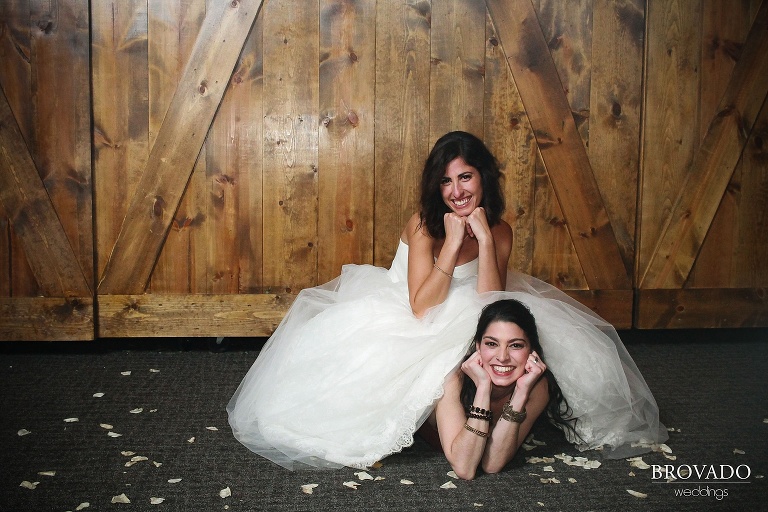 bride and bridesmaid posing in photobooth