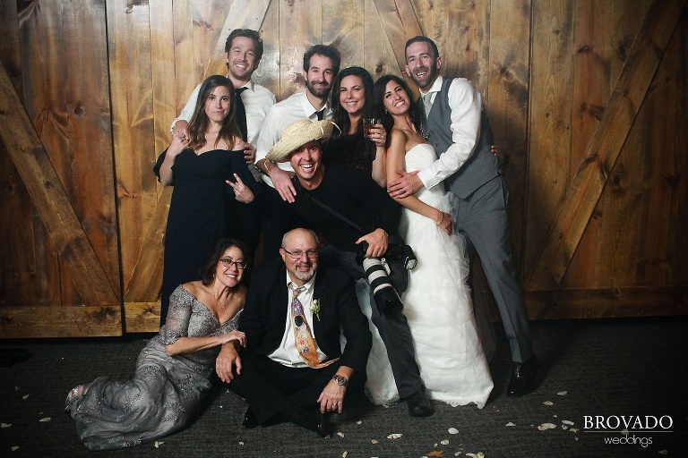Preston Palmer posing with brides and grooms