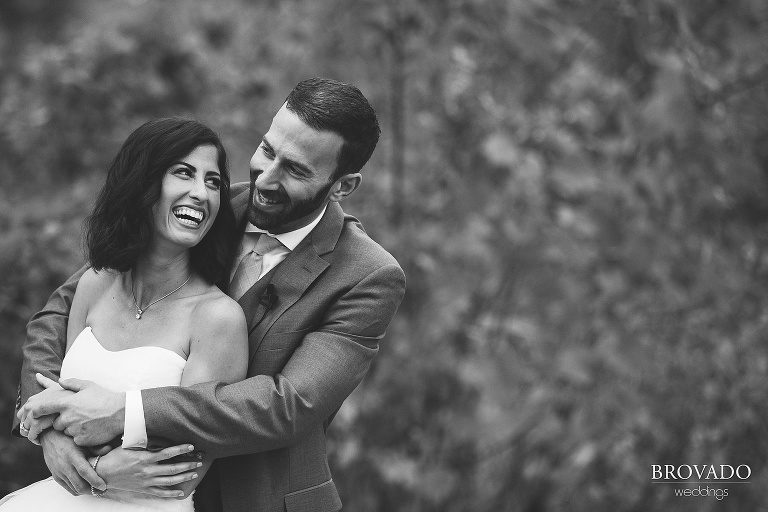black and white laughing wedding photo