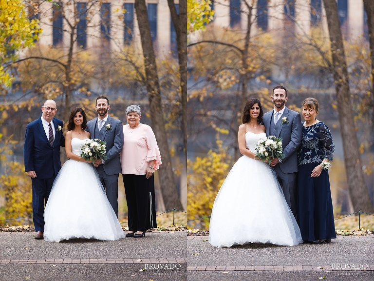 bride and groom posing with their family