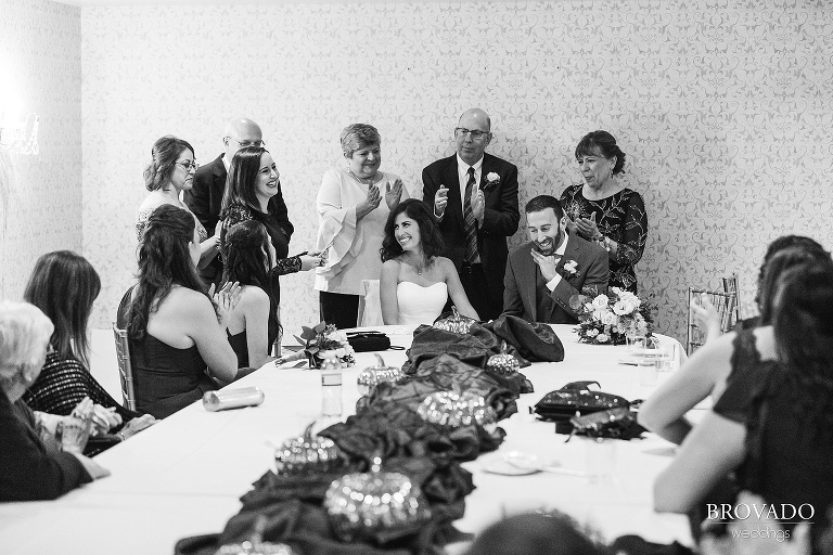 bride and groom signing wedding documents